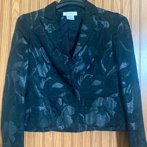 ‘Nine West’ dress jacket. Size 2. Black with pretty silver flower detail.